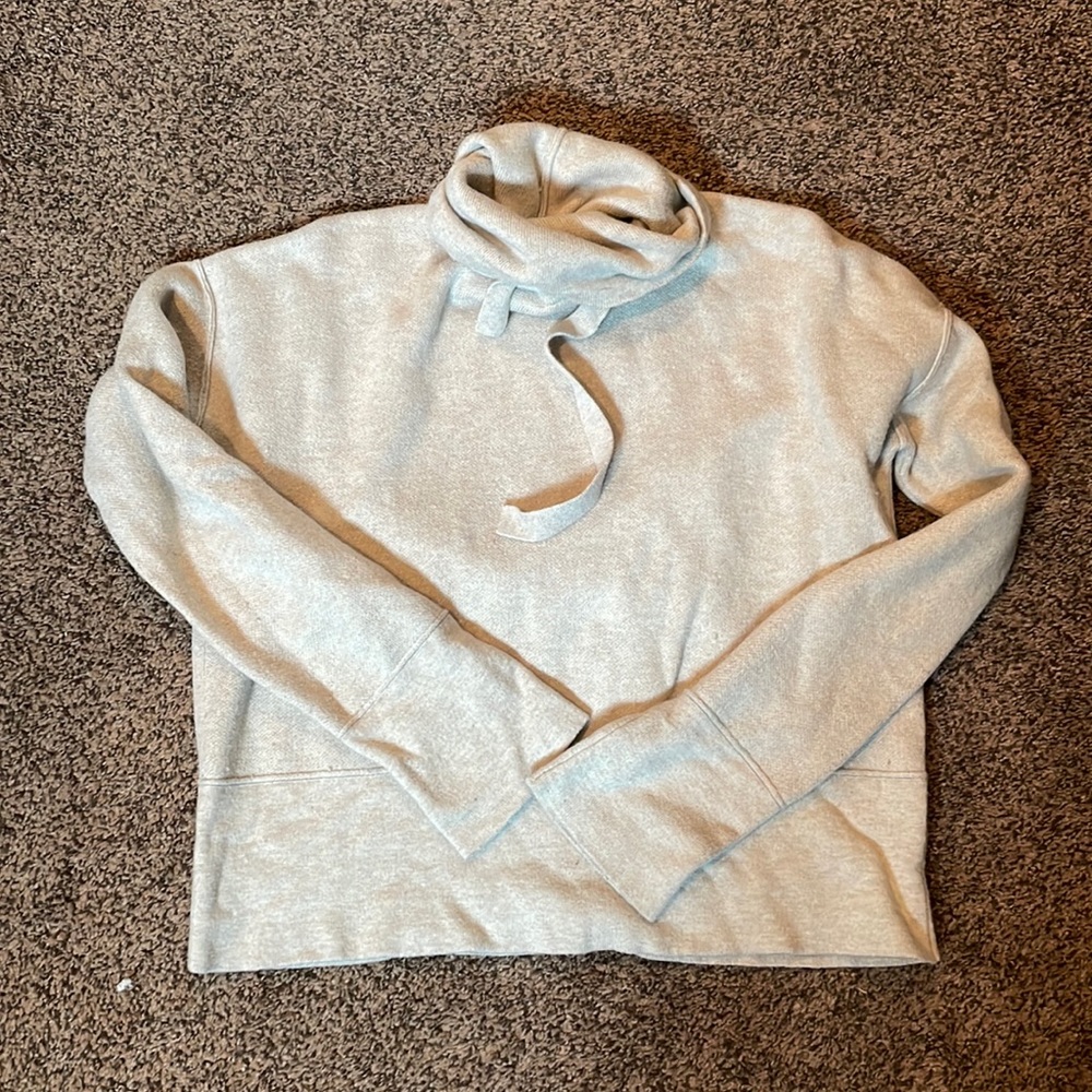 Slightly cropped style sweater. Size small